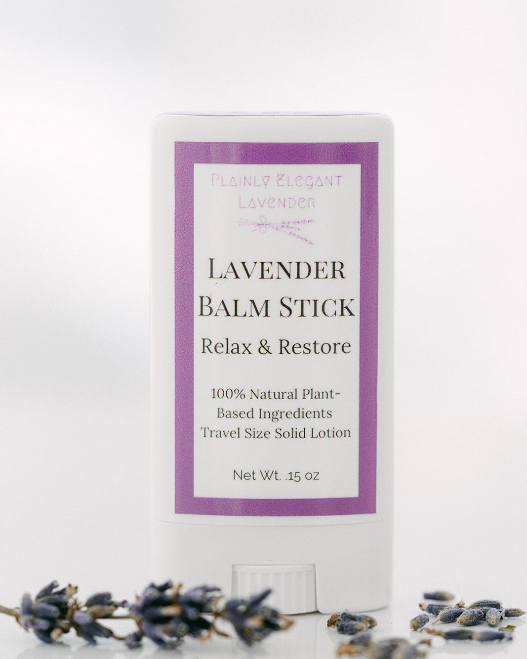 Lavender balm stick with packaging on a white background