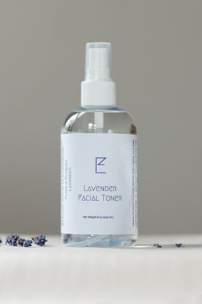 Large Lavender Facial Toner bottle. Clear bottle with white label and white spray top. 